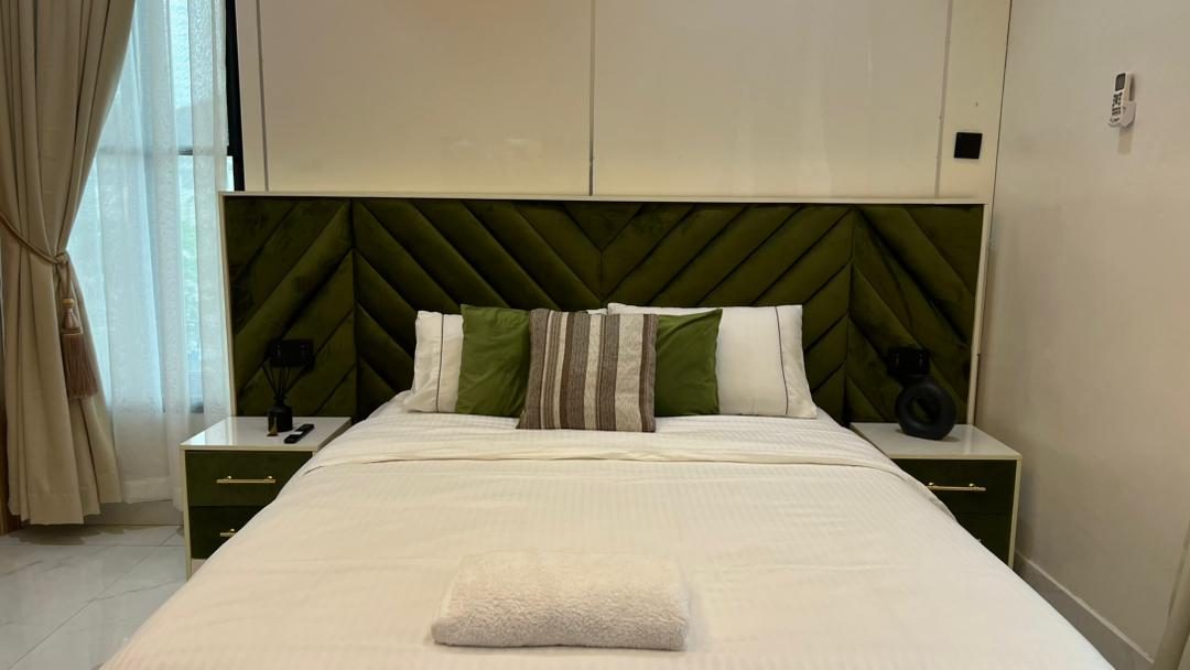 Bedroom with velvet chevron headboard, Apartment Alpha, Nimbus Nook Ikeja GRA