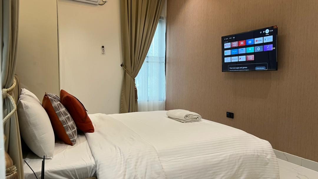 Bedroom with smart TV, Apartment Alpha, Nimbus Nook Ikeja GRA