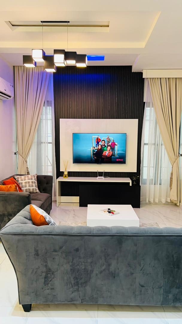 Living room with feature TV wall, Apartment Alpha, Nimbus Nook Ikeja GRA