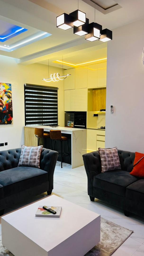 Lounge opening onto the kitchen, Apartment Alpha, Nimbus Nook Ikeja GRA