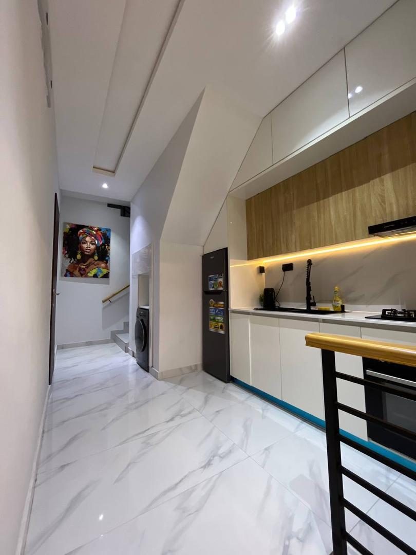 Hallway and kitchen, Apartment Bravo, Nimbus Nook Ikeja GRA