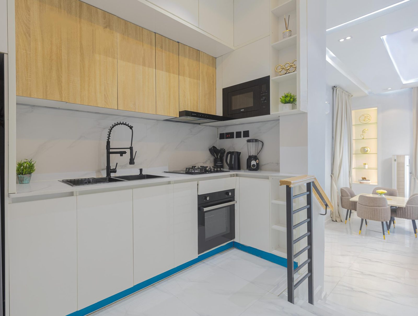 Fully equipped kitchen opening onto the dining area, Apartment Bravo, Nimbus Nook Ikeja GRA