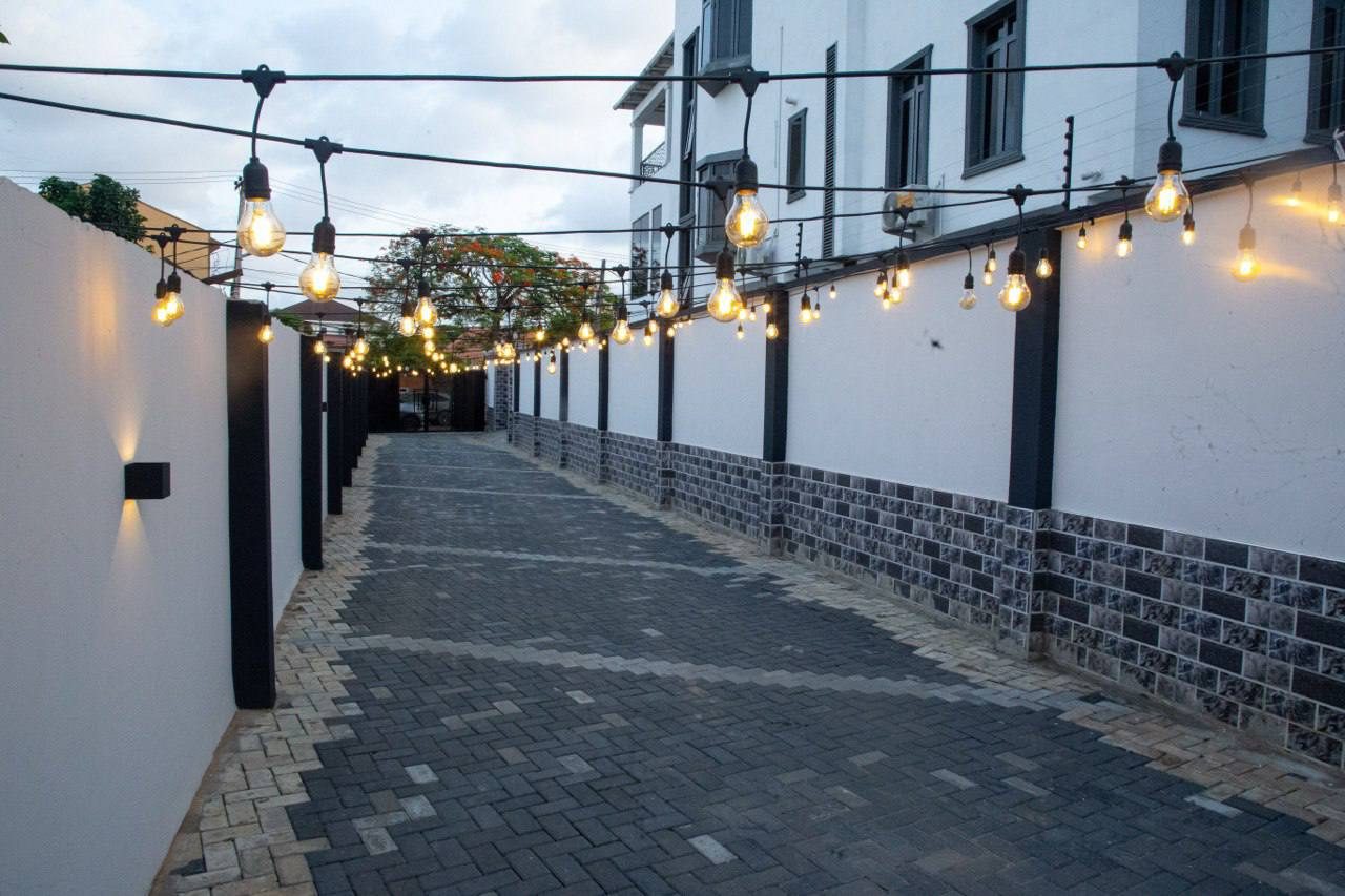 Long, gated driveway at Nimbus Nook Apartments, Ikeja GRA