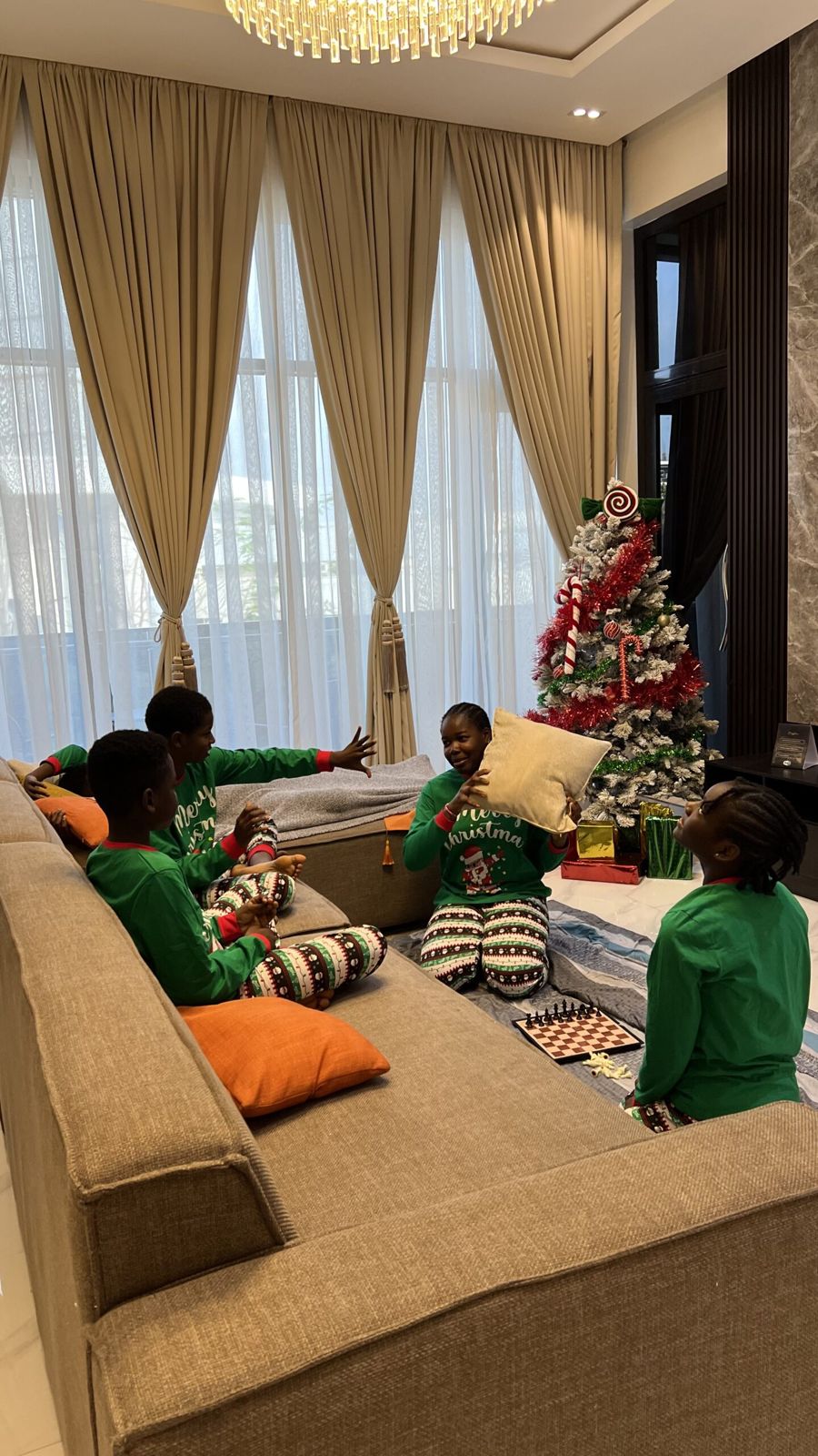 Children playing with cushions and chess in a Nimbus Nook living room