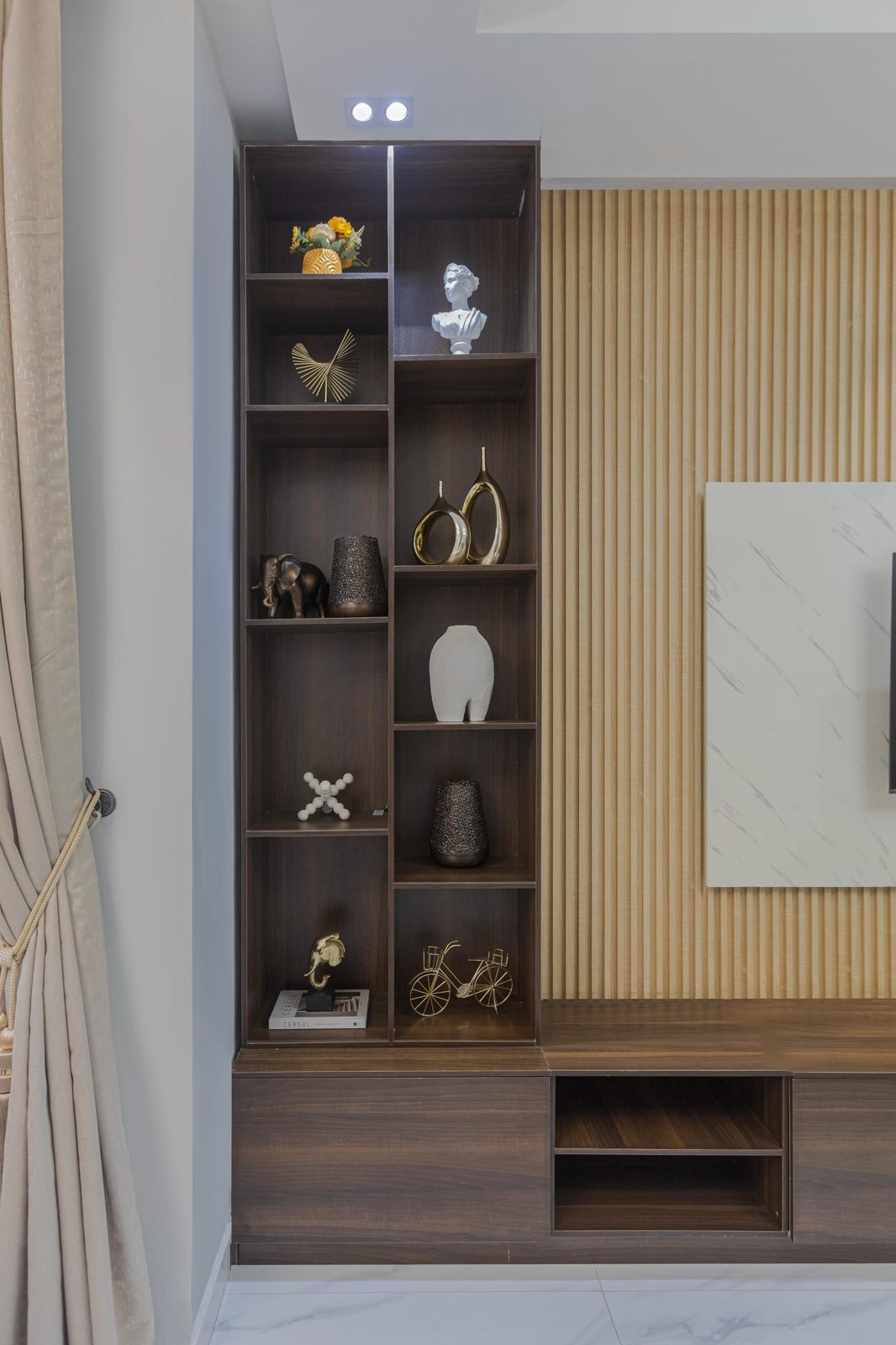 Display shelving and fluted wood wall at Nimbus Nook shortlet apartments, Ikeja GRA