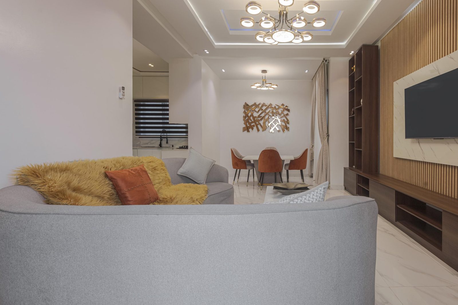 Living room looking through to the dining area at Nimbus Nook shortlet apartments, Ikeja GRA