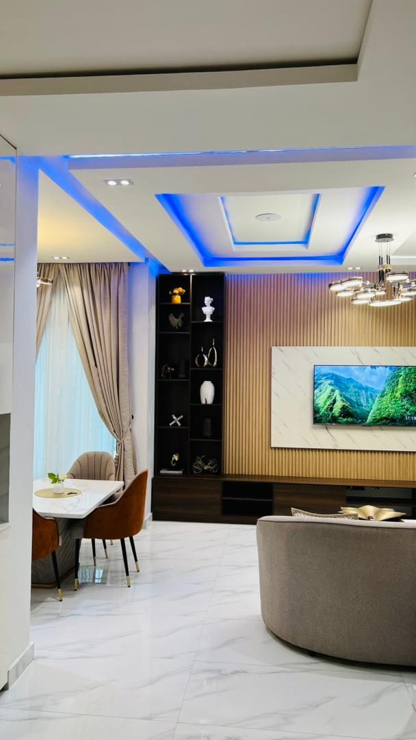 Lounge with ambient ceiling lighting at Nimbus Nook shortlet apartments, Ikeja GRA